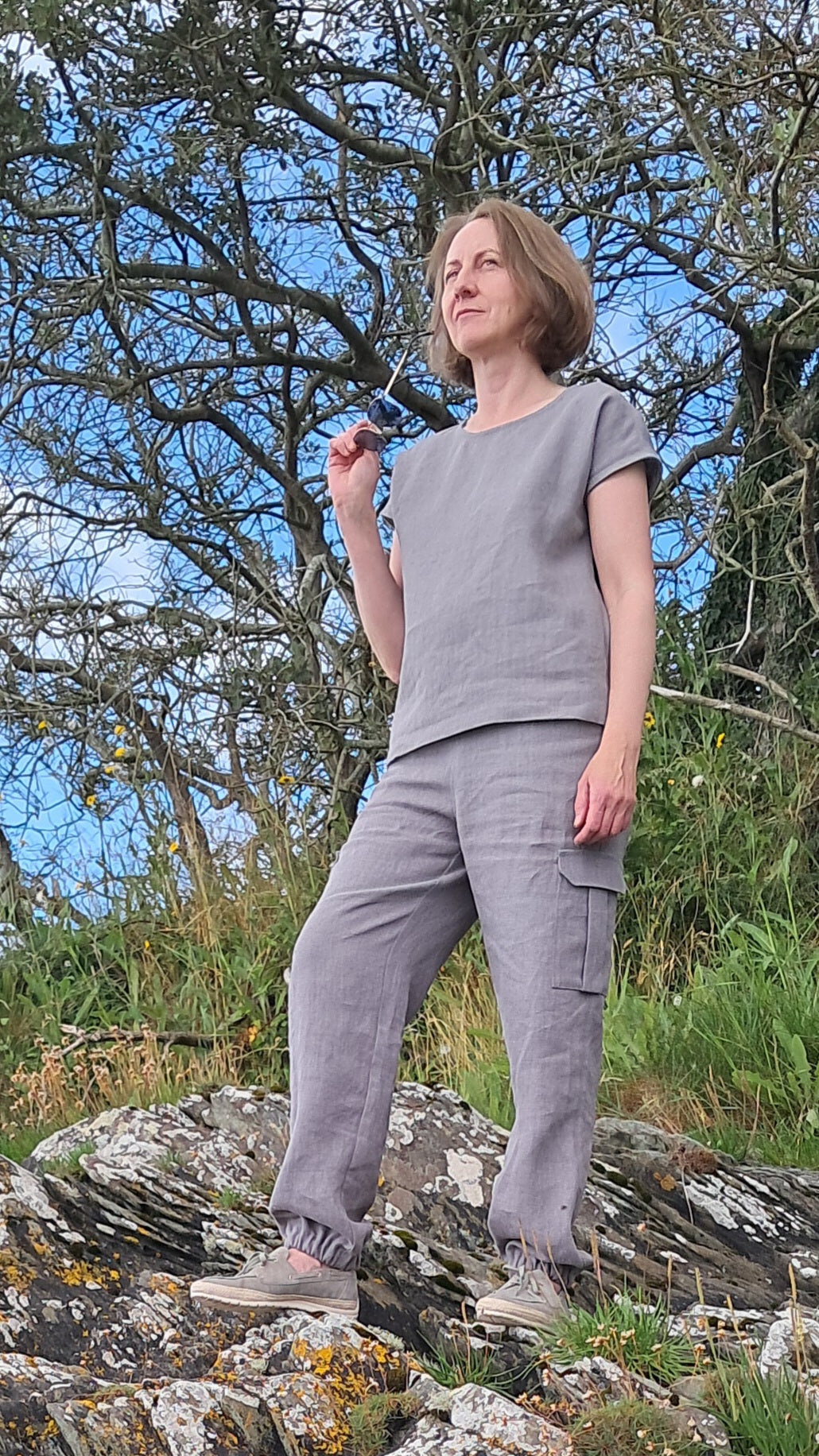 Natural linen top paired with cargo trousers for modern elegance